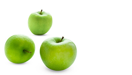 Three juicy green apples isolated on white.