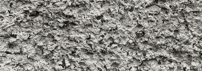 Naturalne tło, tekstury ulicznej ściany tynku strukturalnego.