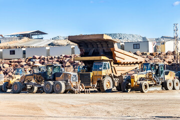 Big mining heavy dump trucks in open mining pit