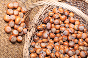 Hazelnuts in a wicker basket close-up