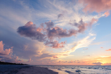 Beautiful colored cloudy evening sky.  Seascape.