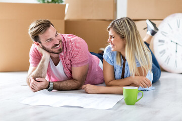 Young couple making plan about there new home