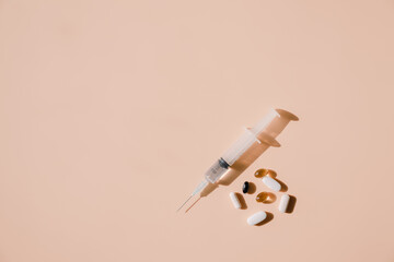 Syringes and pills that have medicine in them.