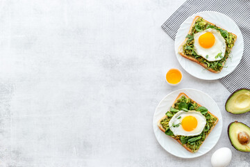 Sandwich with eggs avocado cream and spinach, top view