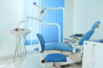 Dentist's office interior with chair and modern equipment