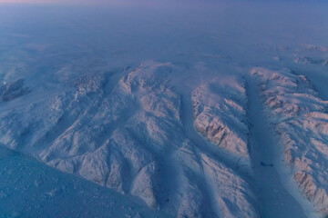 Greenland, aerial view of glacier and snow covered mountains