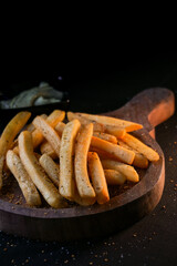 French Fries on a wooden plate, photography