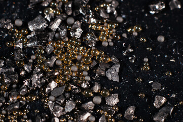 Ion exchange resins with activated carbon on a black background close-up, macro photography