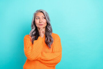 Portrait of attractive grey-haired woman thinking question ask clue guess isolated over bright teal...