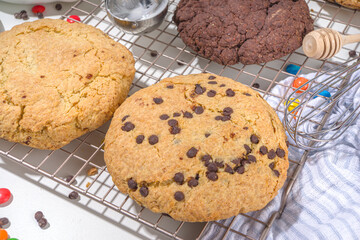 White and chocolate giant cookies. Very big cookies – chocolate, vanilla, chocolate chips, with ice cream ball. Trendy sweet baking.