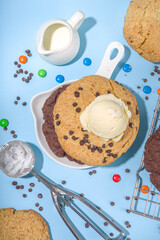 White and chocolate giant cookies. Very big cookies – chocolate, vanilla, chocolate chips, with ice cream ball. Trendy sweet baking.