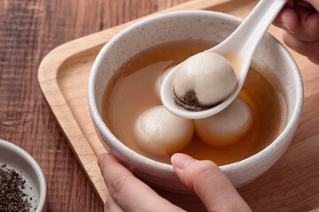 Sesame big tangyuan with syrup soup.