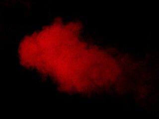 Cloud of red smoke on black background
