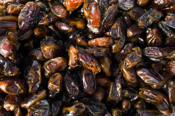 Dried date fruits in the box , dates background