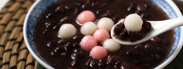 Red and white tangyuan with red bean soup.