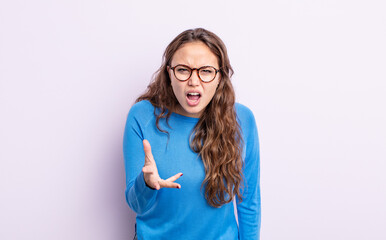 hispanic pretty woman looking angry, annoyed and frustrated screaming wtf or what’s wrong with you