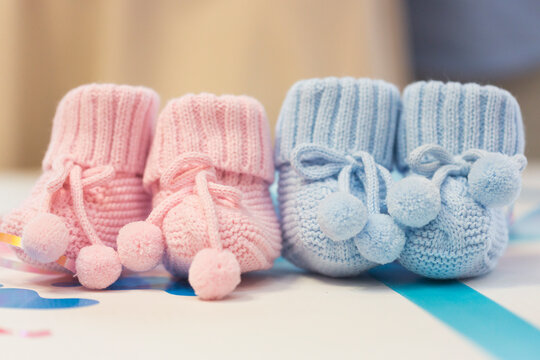 Blue and pink booties at gender party 