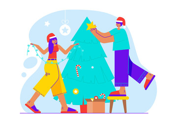 Young woman and man decorate Christmas tree