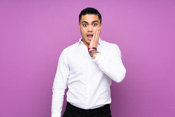 Asian handsome man isolated on blue background with surprise and shocked facial expression