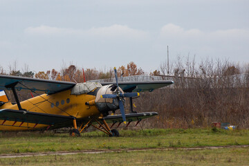Agricultural aircraft landed on a green field