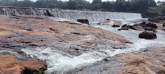 A small river in Dang, a dam built to hold water in the river