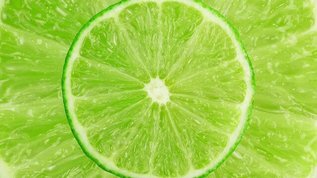 Lime stop motion animation. Looping animation of round green lime slice, juicy citrus, fresh organic fruit close up