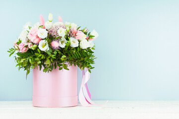 Bouquet of fresh flowers close up on blue background