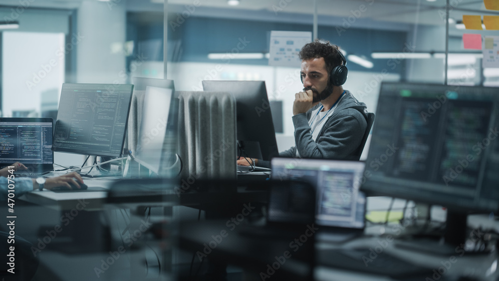 Poster Diverse Office: White IT Programmer Working on Computer. Male Specialist Creating Innovative Software. Engineer Developing App, Program, Video Game. Wearing Headphones Listening Podcast, Music