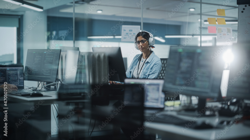 Aufkleber Diverse Office: Indian IT Programmer Working on Computer. Female Specialist Creating Innovative Software. Engineer Developing App, Program, Video Game. Wearing Headphones Listening Podcast, Music