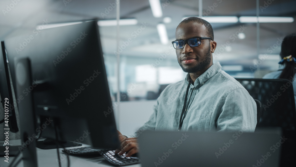 Poster Real Office: Professional Black IT Programmer Working on Desktop Computer. Male Website Developer and Software Engineer Developing App, Video Game. Progressive, Innovative and Inspirational Person