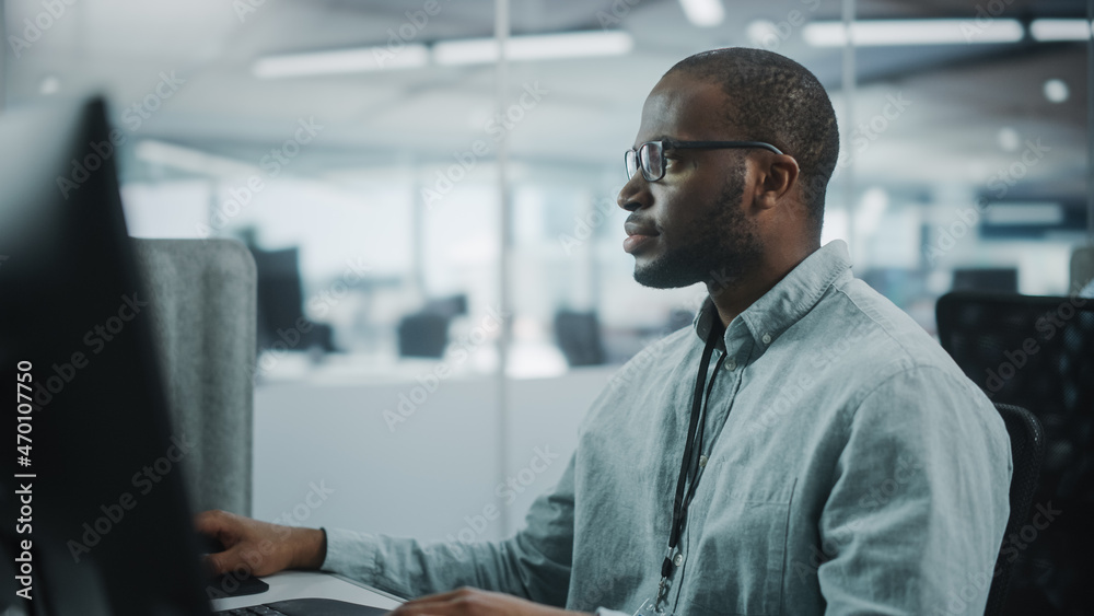 Aufkleber Real Office: Professional Black IT Programmer Working on Desktop Computer. Male Website Developer and Software Engineer Developing App, Video Game. Progressive, Innovative and Inspirational Person