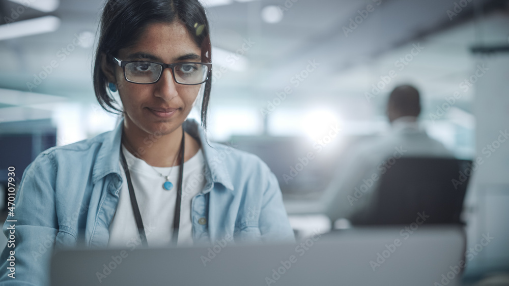 Poster Diverse Office: Portrait of Beautiful Indian IT Programmer Working on Desktop Computer. Empowered Female Software Engineer Creating Innovative App, Program, Video Game in Friendly Environment