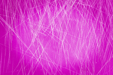 Pink, plastic, grained cutting board with a lot of scratches as background or texture.