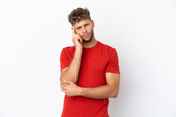 Young caucasian handsome man isolated on white background thinking an idea