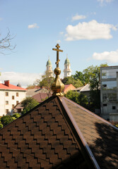The cross is a symbol of the Orthodox faith, and the domes of the church on a background of blue...