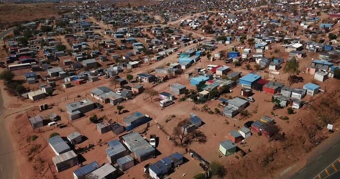 4K aerial drone video of Otjomuise slums poor township near Windhoek on hot sunny day in central Namibia, southern Africa
