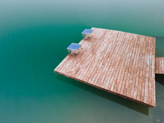 Wooden board and blue swimming starting blocks for jumping into the water, swimming pool, ocean and...