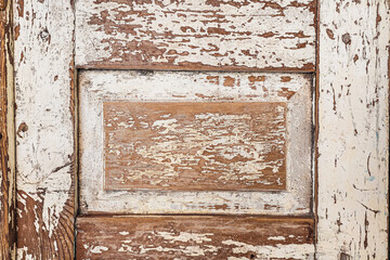 Vintage worn wooden door with peeling paint