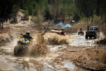 ATV and UTV riders in hard dirt track. Extreme ride. 4x4