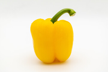 A fresh yellow paprika on the white background.