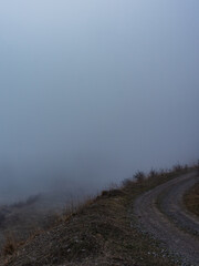 mountain road in fog