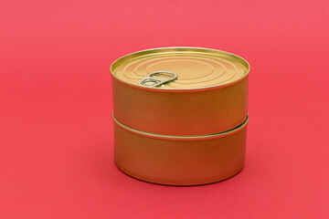 A Group of Stacked Tin Cans with Blank Edges on Red Background. Canned Food. Different Aluminum Cans for Safe and Long Term Storage of Food. Steel Sealed Food Storage Containers