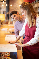 experienced sommelier woman checking taste color sediments of wine