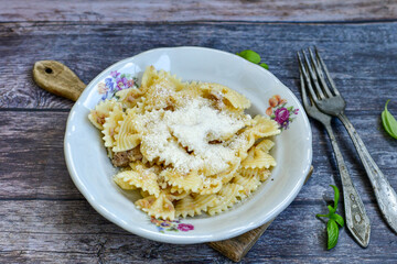 Home made fresh  italian Farfalle rigate  pasta   with tuna  ,parmesan cheese and olive oil