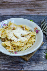 Home made fresh  italian Farfalle rigate  pasta   with tuna  ,parmesan cheese and olive oil