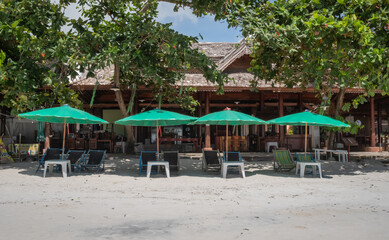 Chairs And Umbrella In Palm Beach for relaxing activity on the beach.