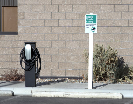 Electric Vehicle Charging station with restrictive parking sign