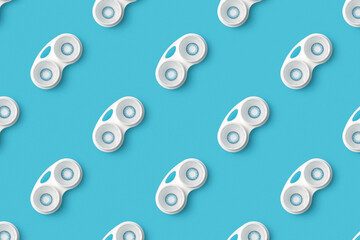 Pattern colored blue contact lenses in a container on a blue background. Top view. Minimalistic flat style.