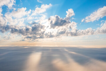 View at sunrise with puffy foggy. Cumulus summer clouds above. White puffy like cloud stretching to...