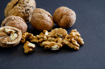 composition of walnuts close-up on a black background